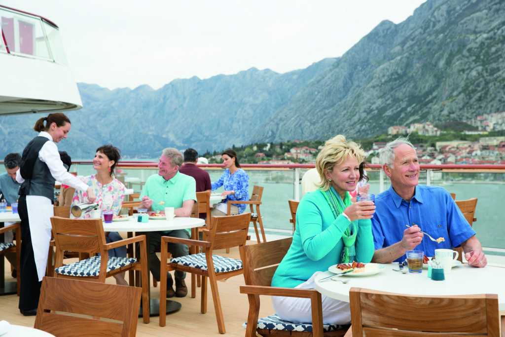People dining on the Viking Star Aquavit Terrace during the day